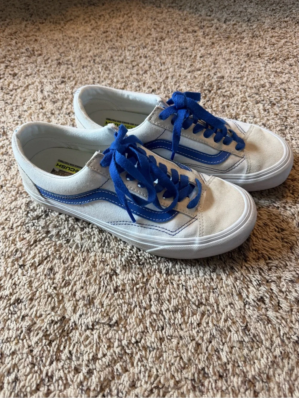 Vans white sneakers with blue stripe and laces